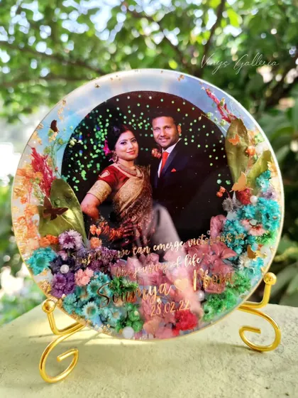 Another shot of the anniversary frame on its stand, capturing the sunlight and its vibrant colors.