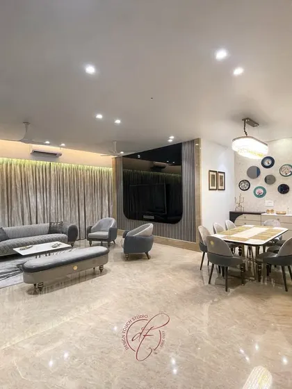 An overall view of the living and dining area, emphasizing the spaciousness and the elegant flow between the zones. The design is a testament to our ability to create beautiful, functional spaces for everyday life.
