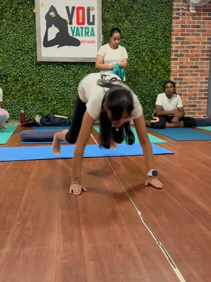 This student practices a jump-through, a dynamic movement that builds core strength and coordination.