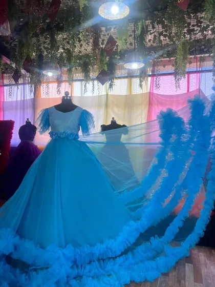 This gown features a detachable ruffle trail, giving you multiple styling options for your photoshoot.
