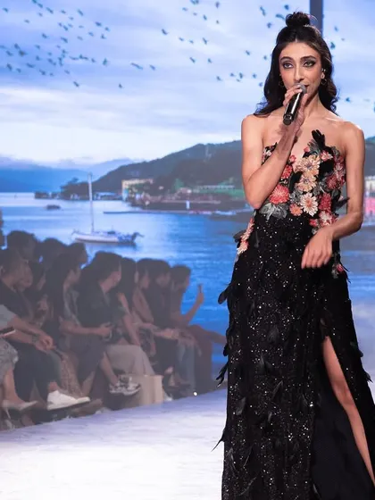 Singing with the beautiful lakeside projection behind me at Lakmé Fashion Week. The entire production was a stunning fusion of fashion, music, and art.