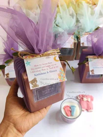 A rainbow of joy for Karishma's baby shower in Mumbai. This mini gift box includes a votive candle with baby feet and a baby onesie fridge magnet, all tied together with a colorful theme and personalized card.
