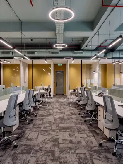 This view of the open-plan workspace shows our focus on creating a bright and orderly environment. The layout provides individual focus areas with low partitions while maintaining a sense of a larger, connected team.
