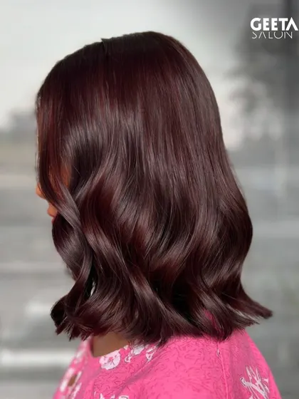 A vibrant burgundy colour on a chic bob, proving that bold colours work beautifully on shorter hair.