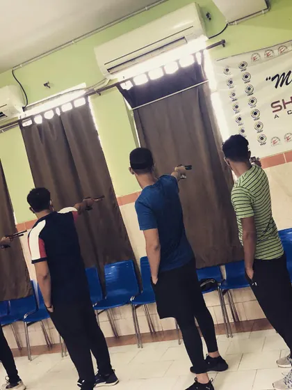Another angle of the blindfolded stance practice. This helps shooters internalize the feeling of a perfect posture without relying on sight.