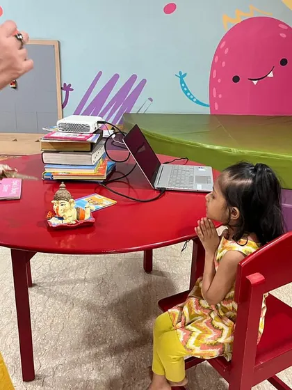 A quiet moment of prayer during our Ganesh Chaturthi celebration. We create a small altar and teach the children about the meaning behind the rituals in a simple way.