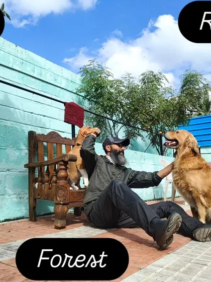 Under the blue skies, sharing love with Leo the Beagle and Rana the Golden Retriever.