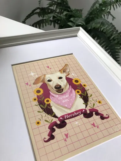 A close-up of the corner of Hershey's framed portrait. The details in the illustration, like the hearts and sparkles, are perfectly clear in the final print.