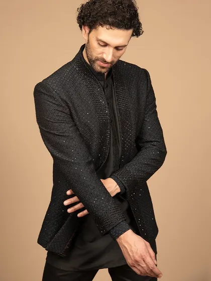 A closer look at the black embroidered Bandhgala, showing the texture and detail. The sleek black color adds a touch of elegance to this modern ethnic piece.