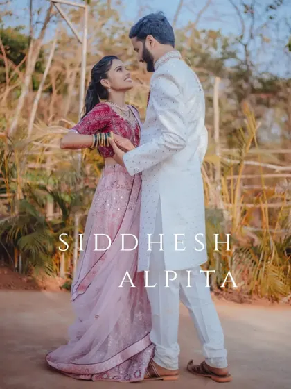 A full-length portrait of Siddhesh and Alpita, capturing a dance-like pose that shows their joyful connection.