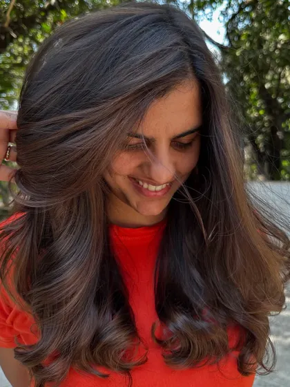 A happy client after her highlight refresh.