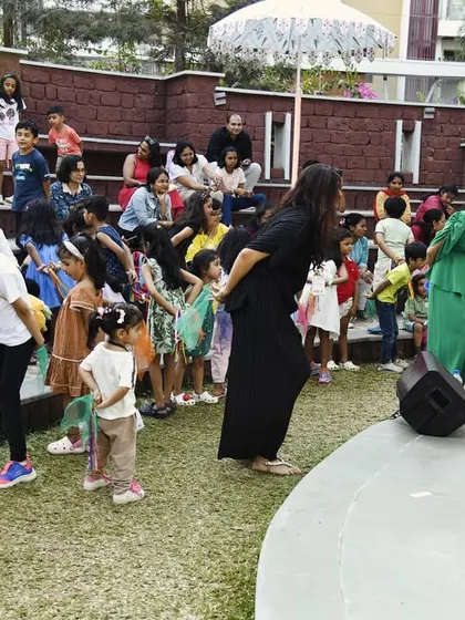 We love getting off the stage and interacting directly with the children. Here, we are leading a call-and-response activity with the young audience at an outdoor festival.
