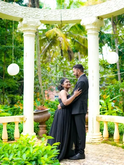 A candid, happy moment between a couple in a beautiful garden gazebo. My goal is to capture your natural connection and joy.