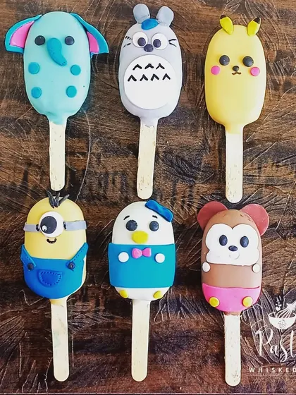 I love bringing your favorite characters to life with these custom-made cakesicles. These fun, bite-sized treats are filled with cake and ganache, perfect for kids' parties or as a unique gift.