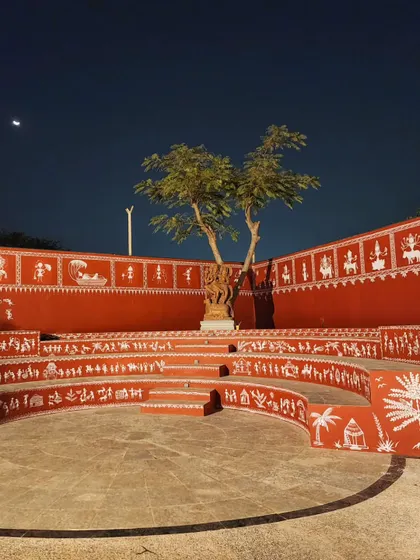 We covered this entire outdoor amphitheater at Epsilon in traditional Warli art. The artwork flows across the curved seating tiers, telling stories of village life and culture, turning a public space into a massive canvas.