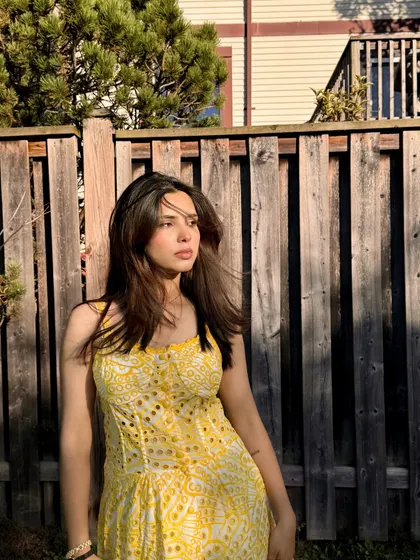 A close-up portrait in the Jardinvue dress, capturing the soft, sunny day vibes.