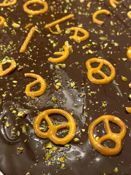 Making our chocolate pretzel bark, a sweet and salty treat that's perfect for holiday snacking and gifting.