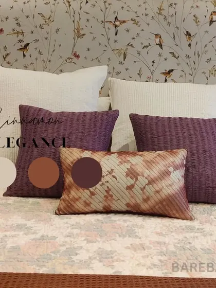 Cinnamon elegance. Another detail shot from the same project, this time pairing a delicate hummingbird wallpaper with textured purple and tie-dye accent pillows.
