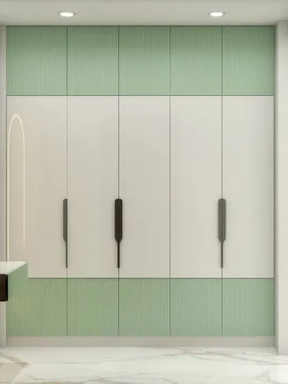 This 3D render shows a wardrobe design with a combination of mint green fluted panels and plain white shutters. The long, sleek handles give it a very modern and minimalist look.