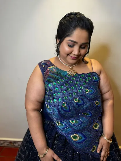 My client Nive looking stunning for her daughter's birthday party. The soft glam makeup perfectly complements her unique self-designed peacock-themed outfit.