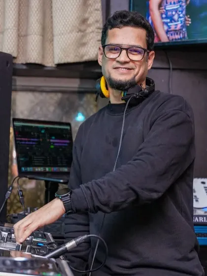 A smile from the DJ booth. I truly enjoy every moment of my performance, and I think the crowd can feel it.