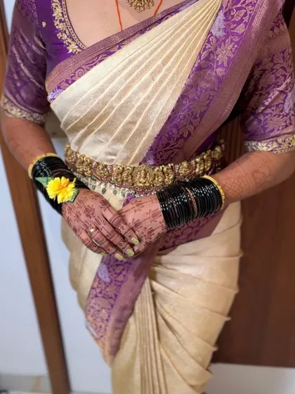 A beautiful traditional look for a baby shower ceremony. The saree is draped perfectly to ensure comfort and elegance for the mother-to-be.