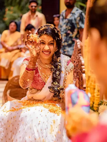 A playful moment during the Haldi. These events are perfect for simple, fun group interactions that don't require complex choreography but create lasting memories.