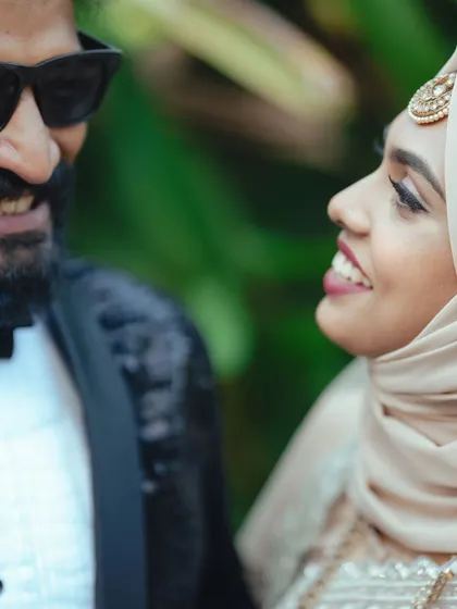 A tight close-up on the couple's faces, capturing their shared laughter and joy in a beautifully intimate way.
