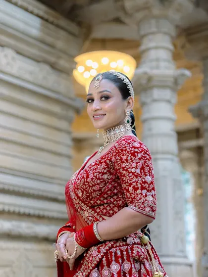 The complete bridal look. From the perfectly placed matha patti to the flawless skin, every detail is considered to create a cohesive and breathtaking result.