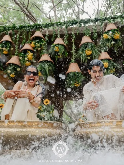 For this Haldi, we focused on a vibrant yellow theme with rustic touches. We used hanging cane baskets filled with yellow flowers, lush greens, and traditional brass urlis to create a warm and sunny celebration.