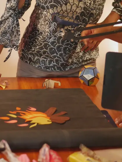 Another behind-the-scenes shot from our stop-motion workshop, showing a campfire scene being set up with paper cutouts.
