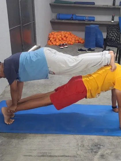 This double plank variation is a great example of the creative and challenging poses our campers work on.