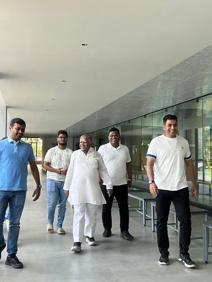 Distinguished guests walk alongside our Myrtha pool, observing the world-class aquatic facilities we offer.