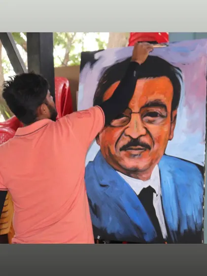 Putting the finishing touches on a large-scale color portrait at an outdoor corporate event. Painting live allows me to interact with the environment and the people around me.