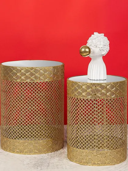 Another stylish set of nesting side tables, these feature a modern fish-scale pattern on a gold metal base. They are perfect for adding a touch of glamour and functionality to a contemporary room.