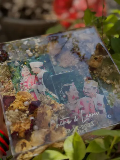 A square keepsake capturing multiple wedding moments. By layering photos, I can create a collage effect within the resin, preserving a timeline of your special day with flowers from your varmala.