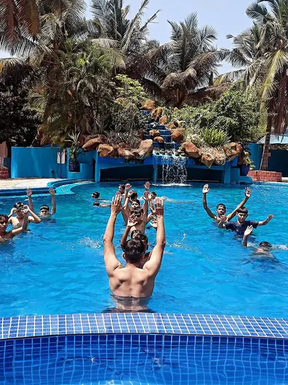 Recovery is as important as training. Here, the team enjoys a hydrotherapy session in the pool, a great way to relax muscles and bond as a team after a tough game.