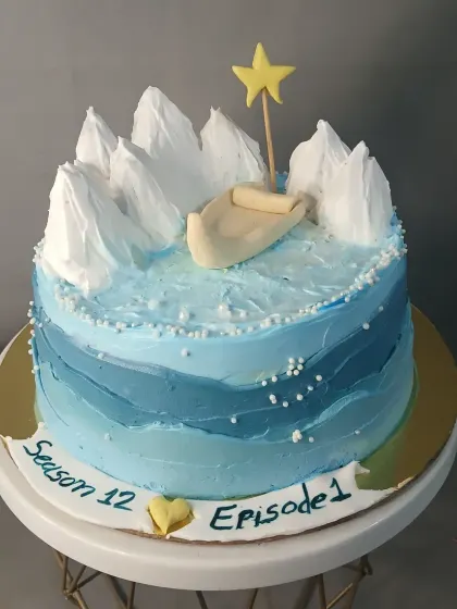 A cake depicting a boat in icy waters, created for a special themed request.