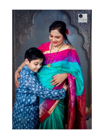 A heartwarming moment between mother and son, as the big-brother-to-be gives a loving hug to the baby bump.