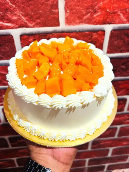 A simple and delicious seasonal mango cake, topped with fresh, juicy chunks of Alphonso mango.