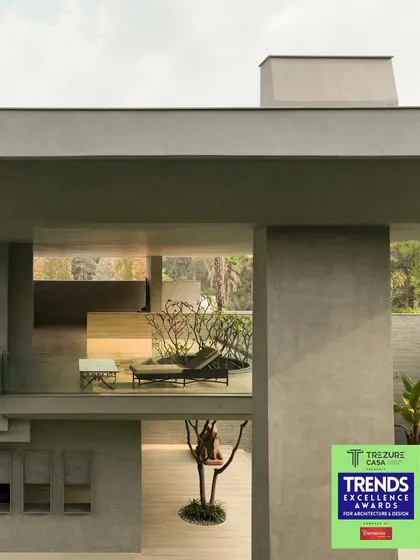 Receiving the Trends Excellence Award for Residential Architecture for the House Around the Oblique Column. This award celebrates the project's unique blend of brutalist design and artistic living.