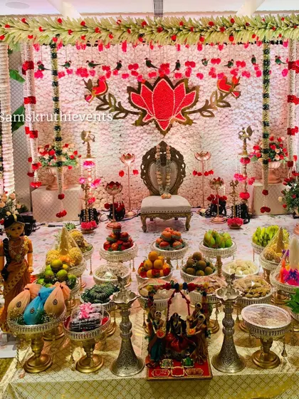 A full setup for a puberty ceremony, designed with perfection. The lotus-themed backdrop and a complete 21-plate arrangement make the occasion feel truly special and grand.