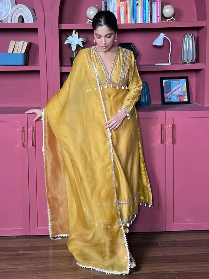 Another shot of Bhumi in the beautiful yellow suit, showing the flow and fall of the fabric.