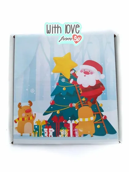 This charming Christmas box shows Santa and his reindeer decorating the tree. I ensure my boxes are made from premium, thick corrugated sheets to keep your gifts safe.