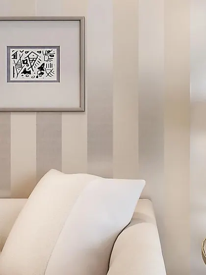 Simple, elegant stripes can make a room feel taller and more refined. This wallpaper features wide, tonal stripes in a neutral palette for a timeless look.