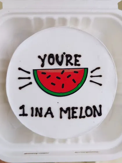 A punny bento cake that says "You're 1 in a melon." A cute and funny way to show someone you care.