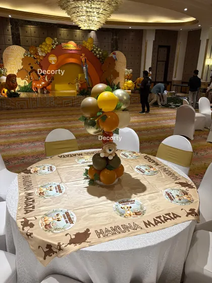 Another view of a guest table, showing how the centerpieces and table decor contribute to the overall themed environment of the venue.