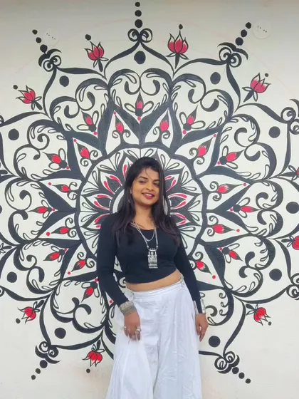 The finished mandala mural, and me feeling so proud. This piece was a labor of love, designed to be a source of calm and inspiration in my friend's home.