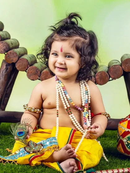 This little Kanha is ready for the festivities, holding his peacock feather and looking absolutely adorable.