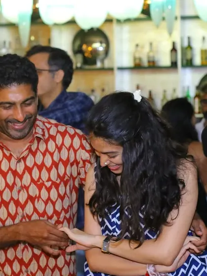 A joyful interaction between two dancers, laughing as they move. The fun is infectious at Havana Nights.